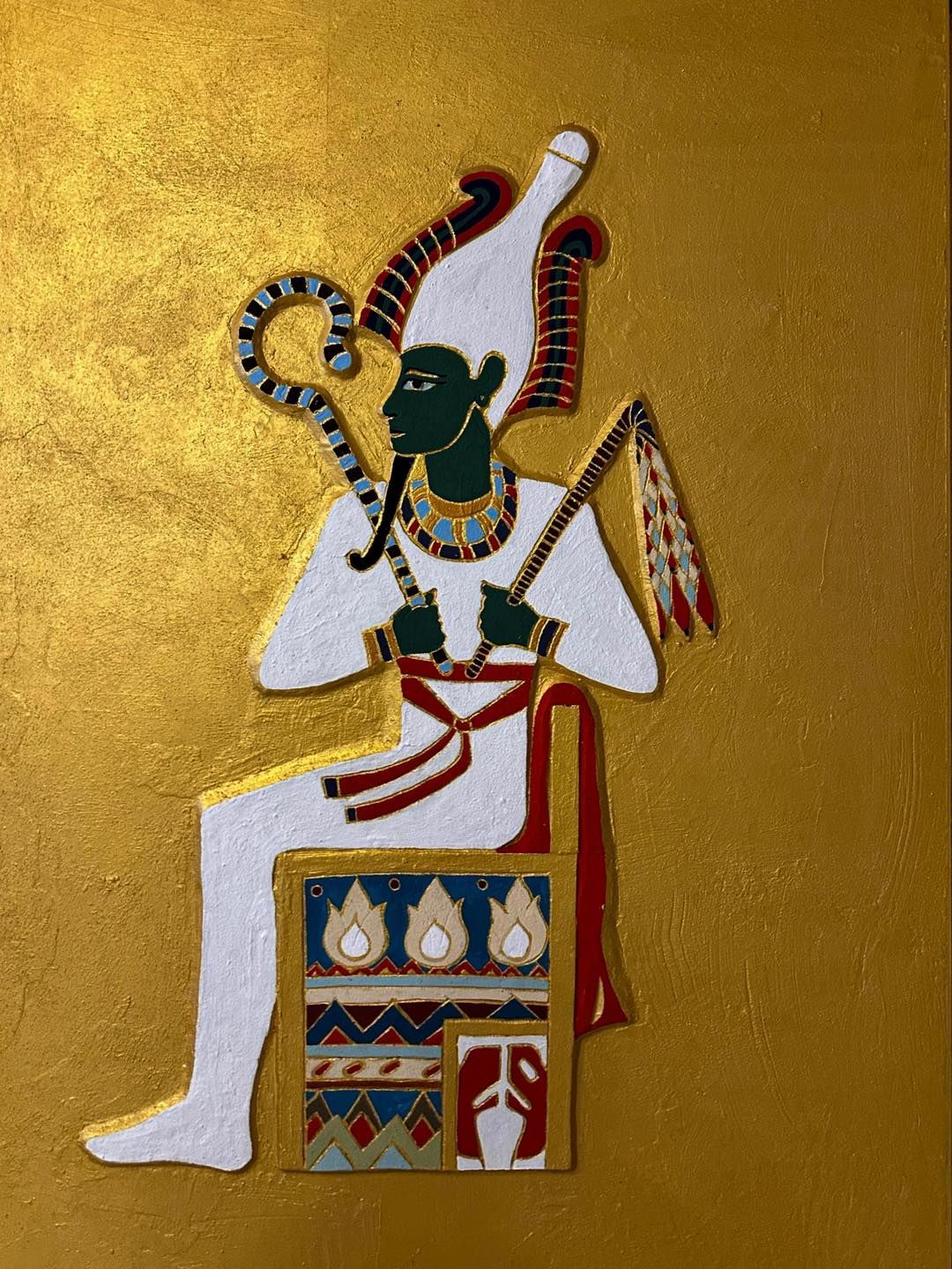 A painting of an ancient egyptian king sitting on a throne