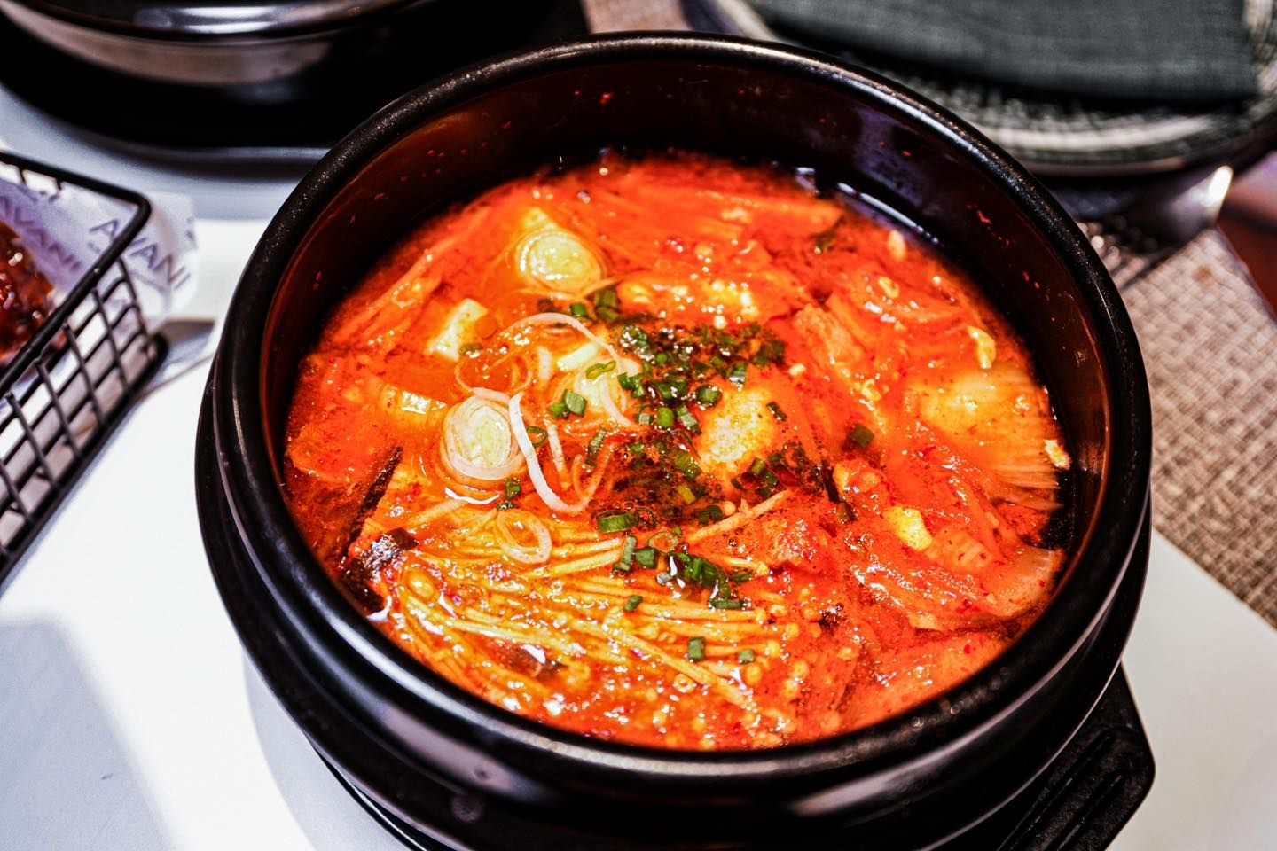 A close up of a bowl of food on a table.