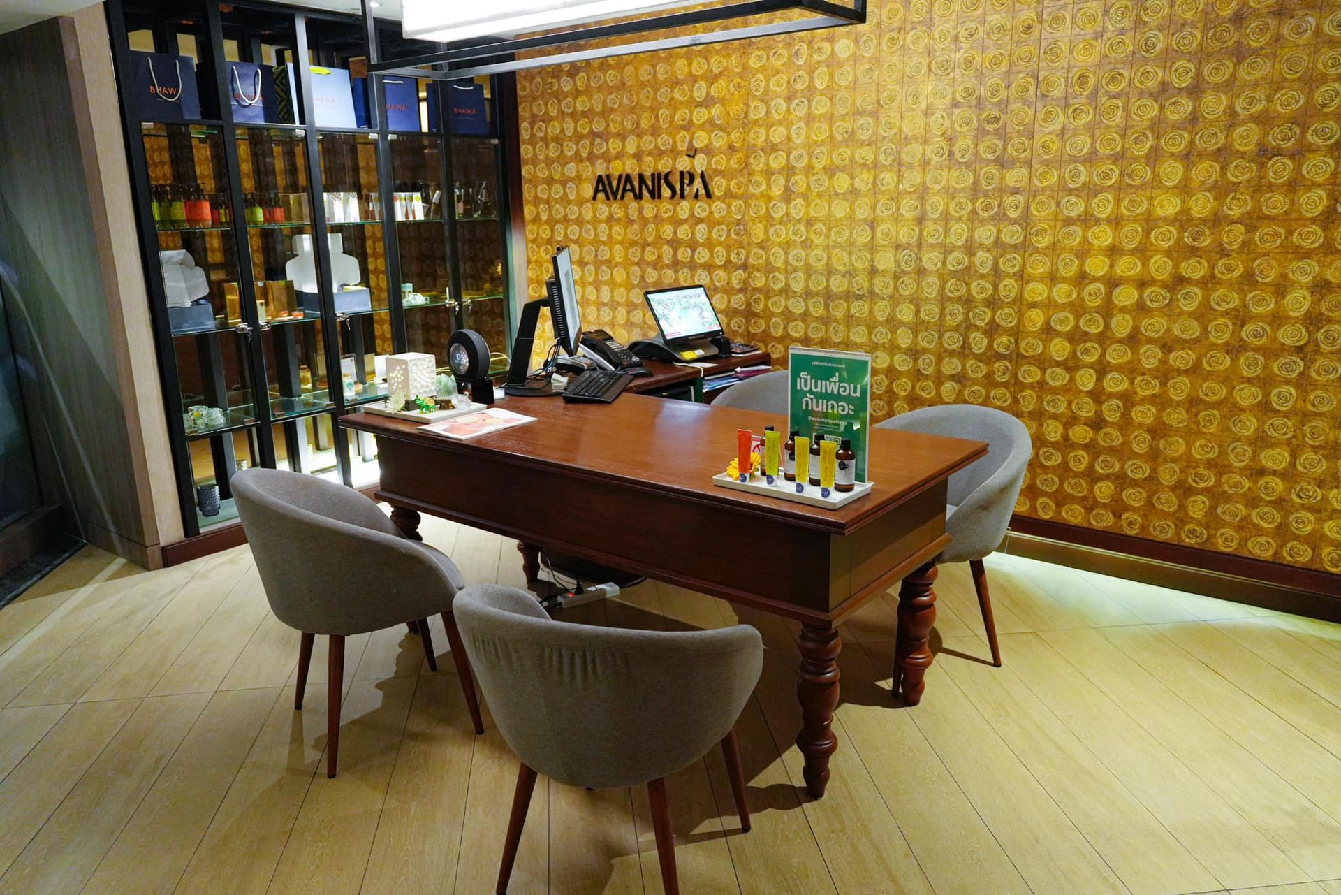 There is a table and chairs in the middle of the room, Avani Spa