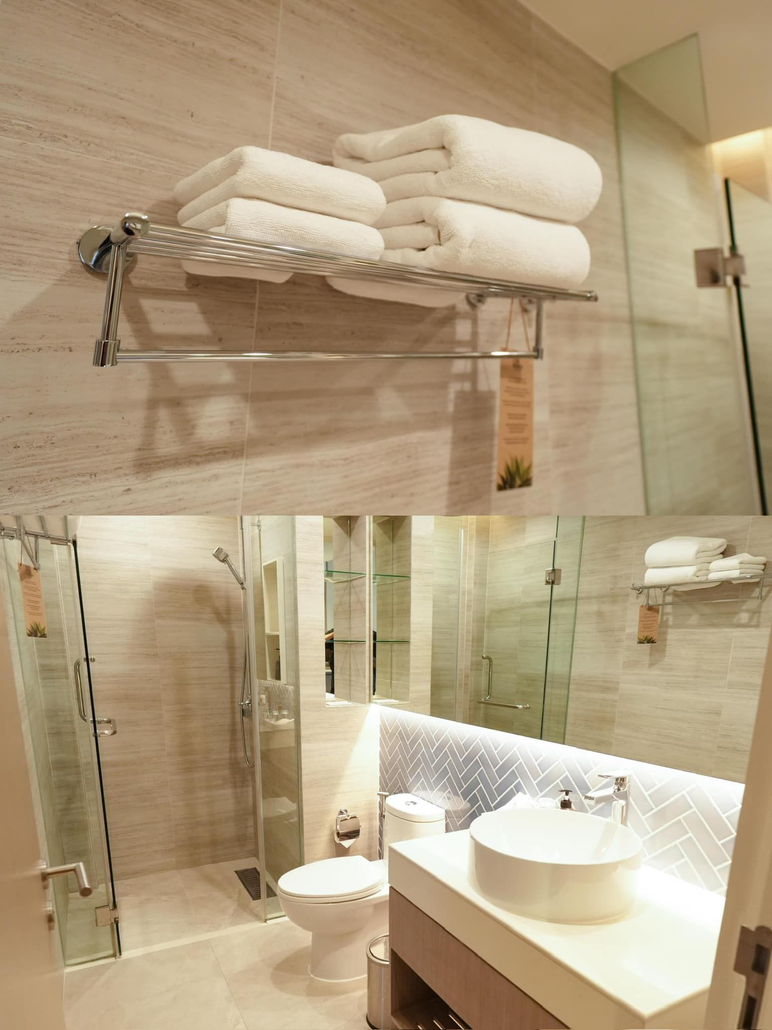 A bathroom with a toilet , sink , mirror and shower.