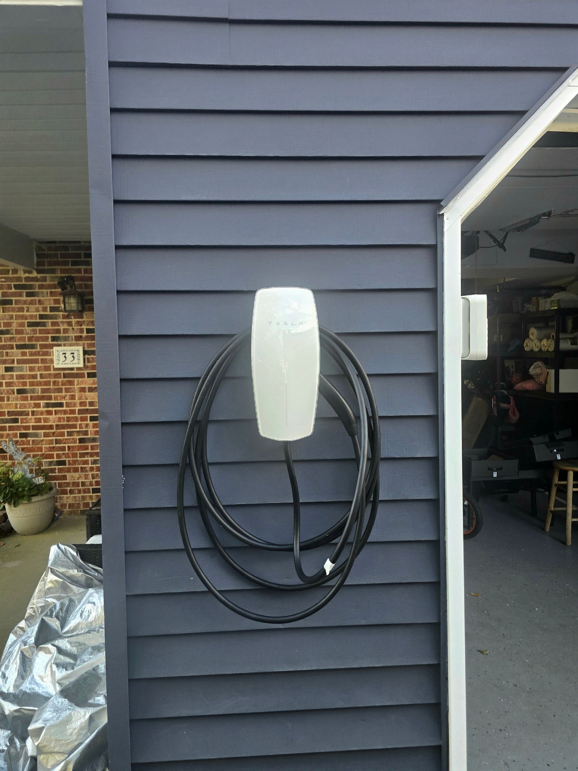 Level 2 EV charger installed in a Monmouth County, NJ home garage by A Shore Thing Electric.