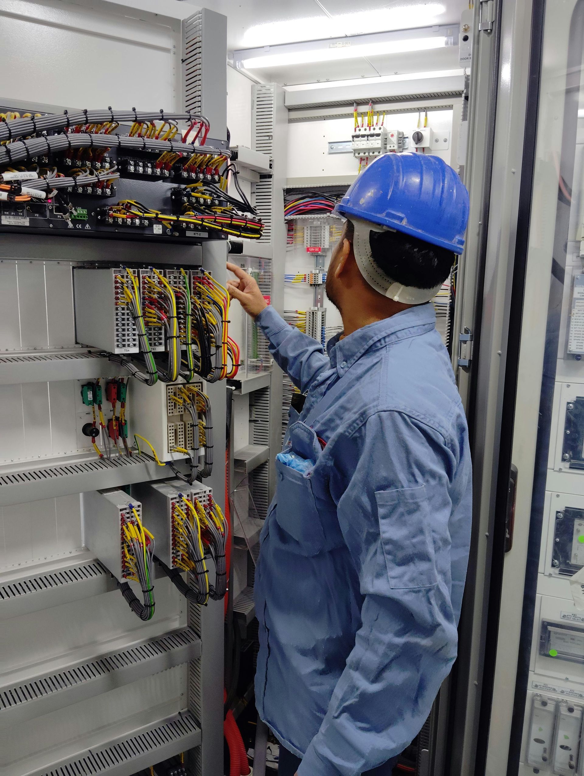 A professional electrician is doing some timely elecrtrical repairs.