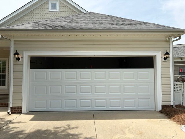 Off-track garage door needing repair in Huntersville