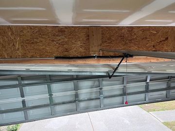 Crashed garage door needing repair