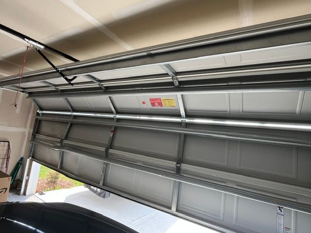 Off-track garage door needing repair in Huntersville