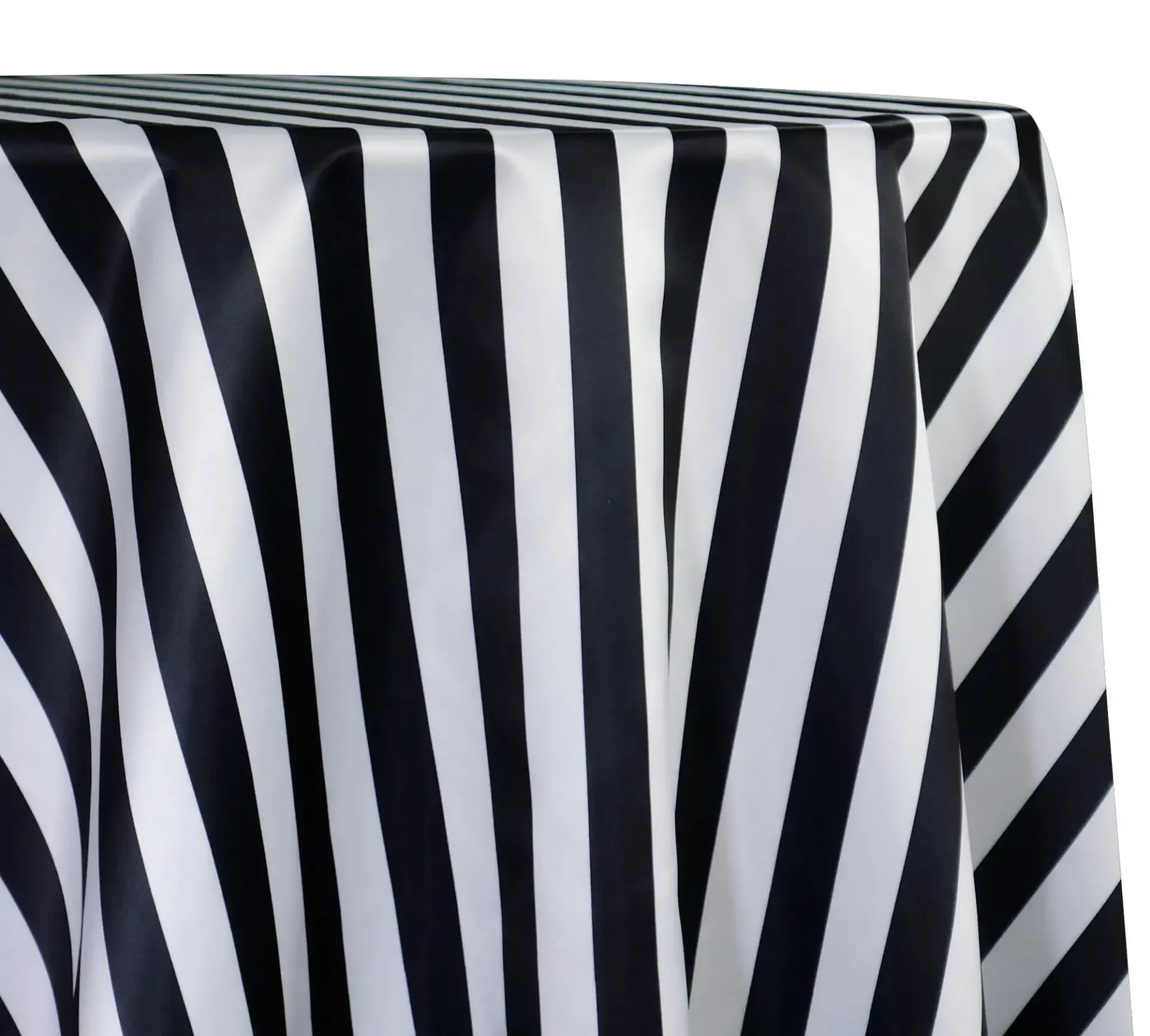 Black and white striped fabric draped over the corner of a box or table