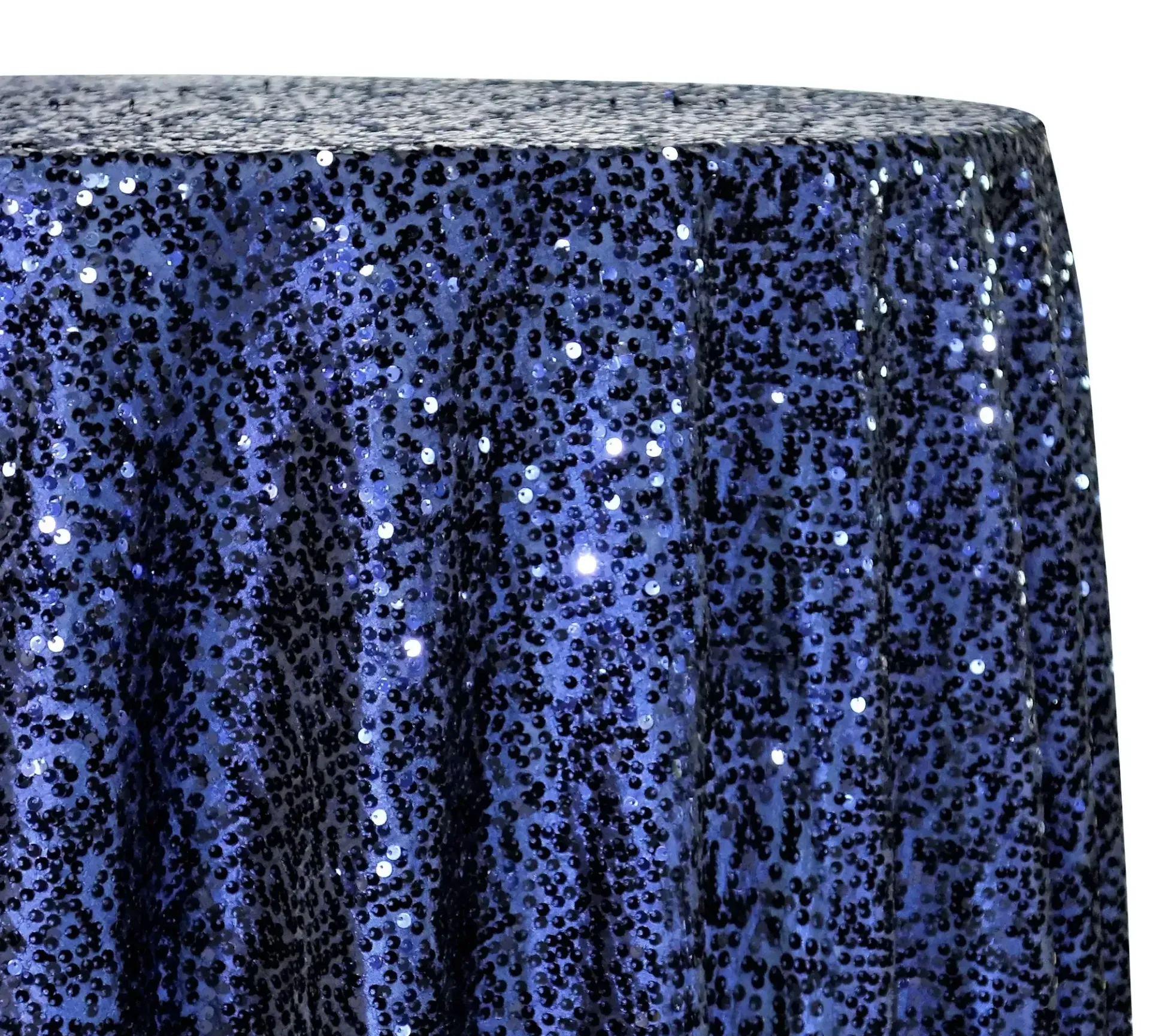 Blue sequined tablecloth draped over a round table top