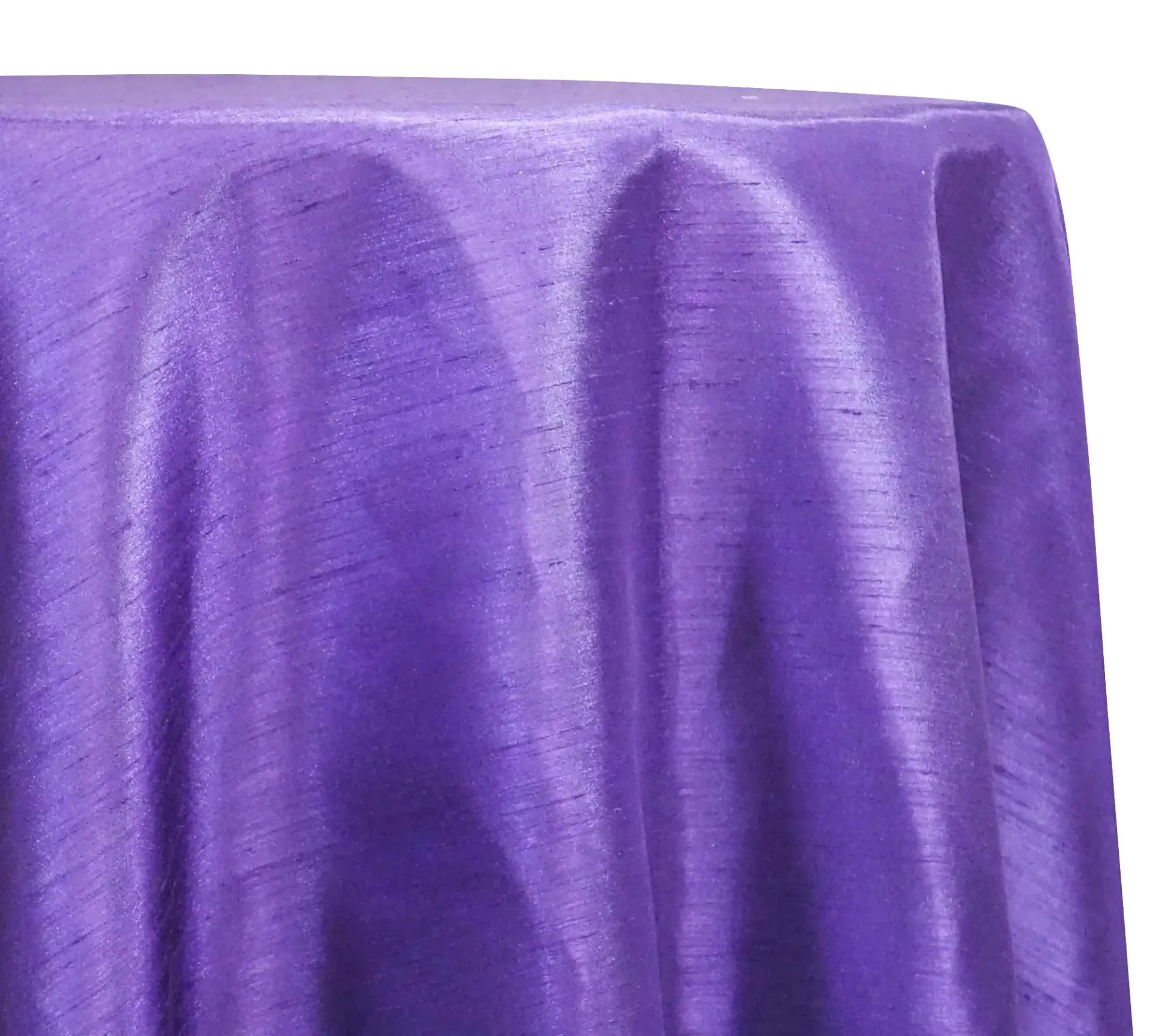 Purple satin draped over a table, gathered in soft folds