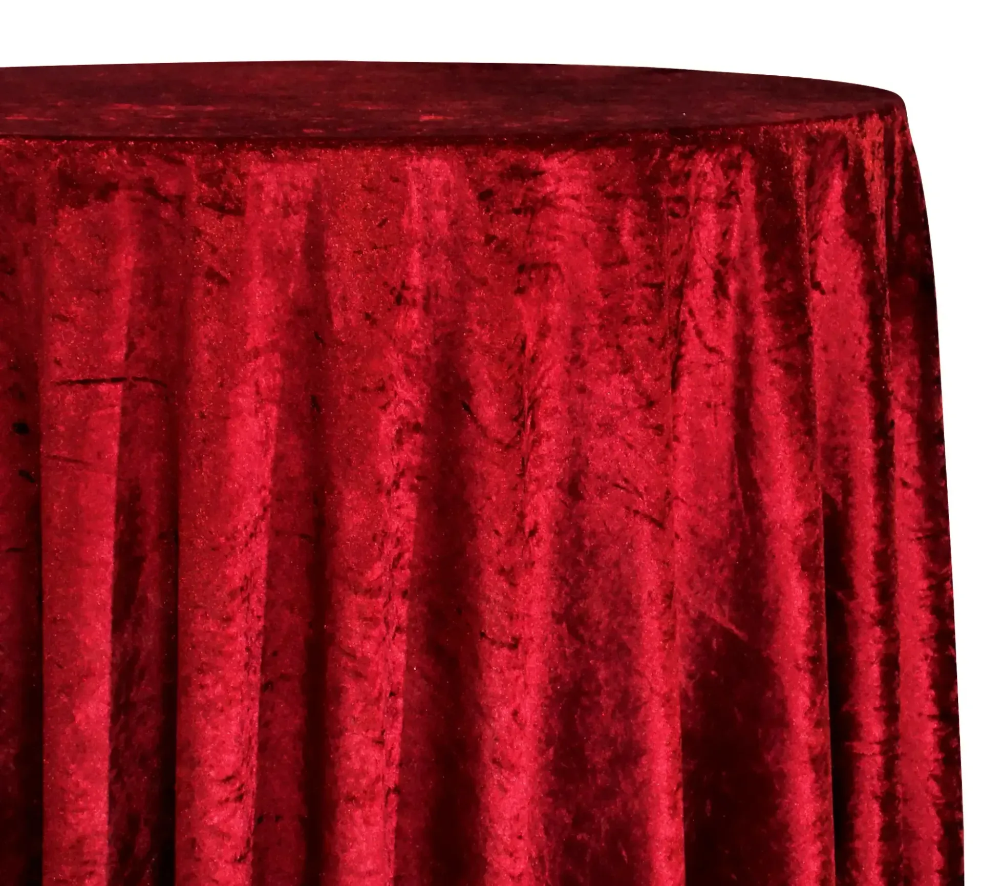 Red velvet-draped round table against a plain white background