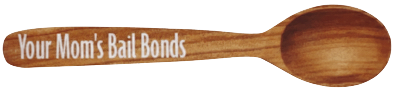 Wooden spoon with engraved text “Your Mom’s Bail Bonds”