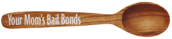 Wooden spoon with engraved text “Your Mom’s Bail Bonds”