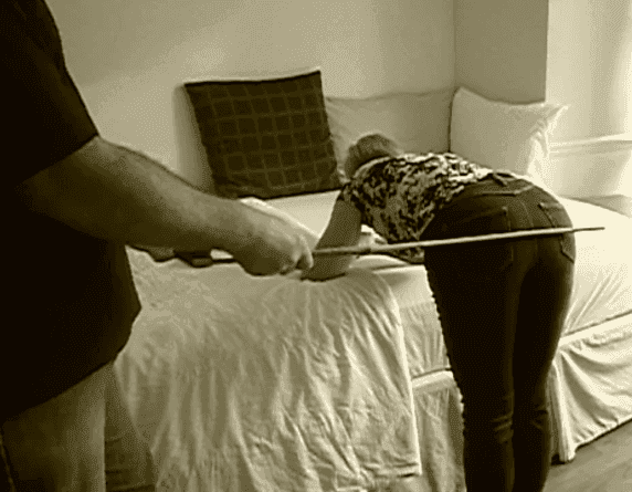 Mature strict male dominant disciplinarian master administers corporal punishment for women