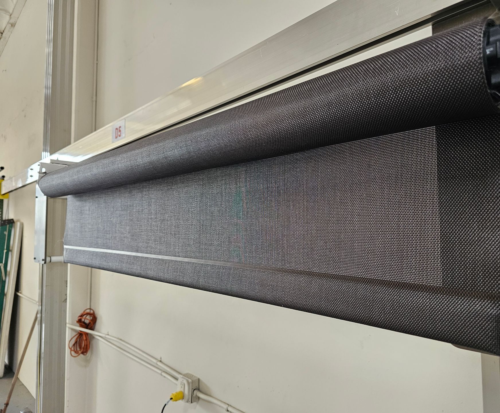Custom Roller Shades being made in Rialto CA by The Roman Shades