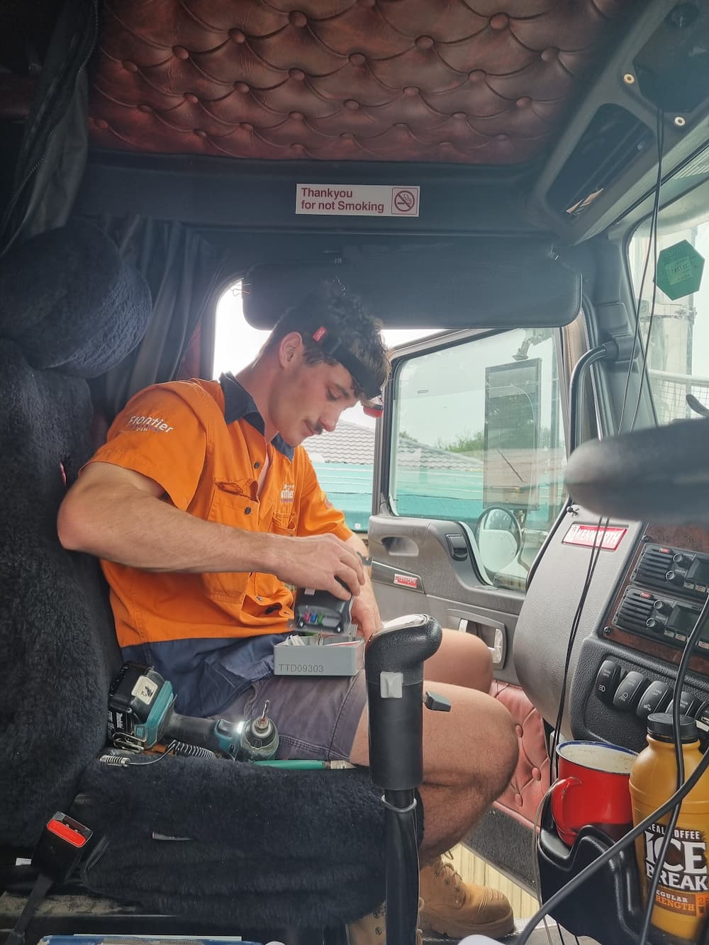 Installing Something On A Driver Seats — Telematics and Fleet Management In Garbutt, QLD