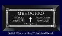 Black polished memorial plaque with silver border, engraved names, and a cross in the center.