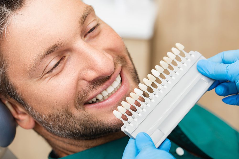 Dentist Recommending Veneers to Patient in Cairns