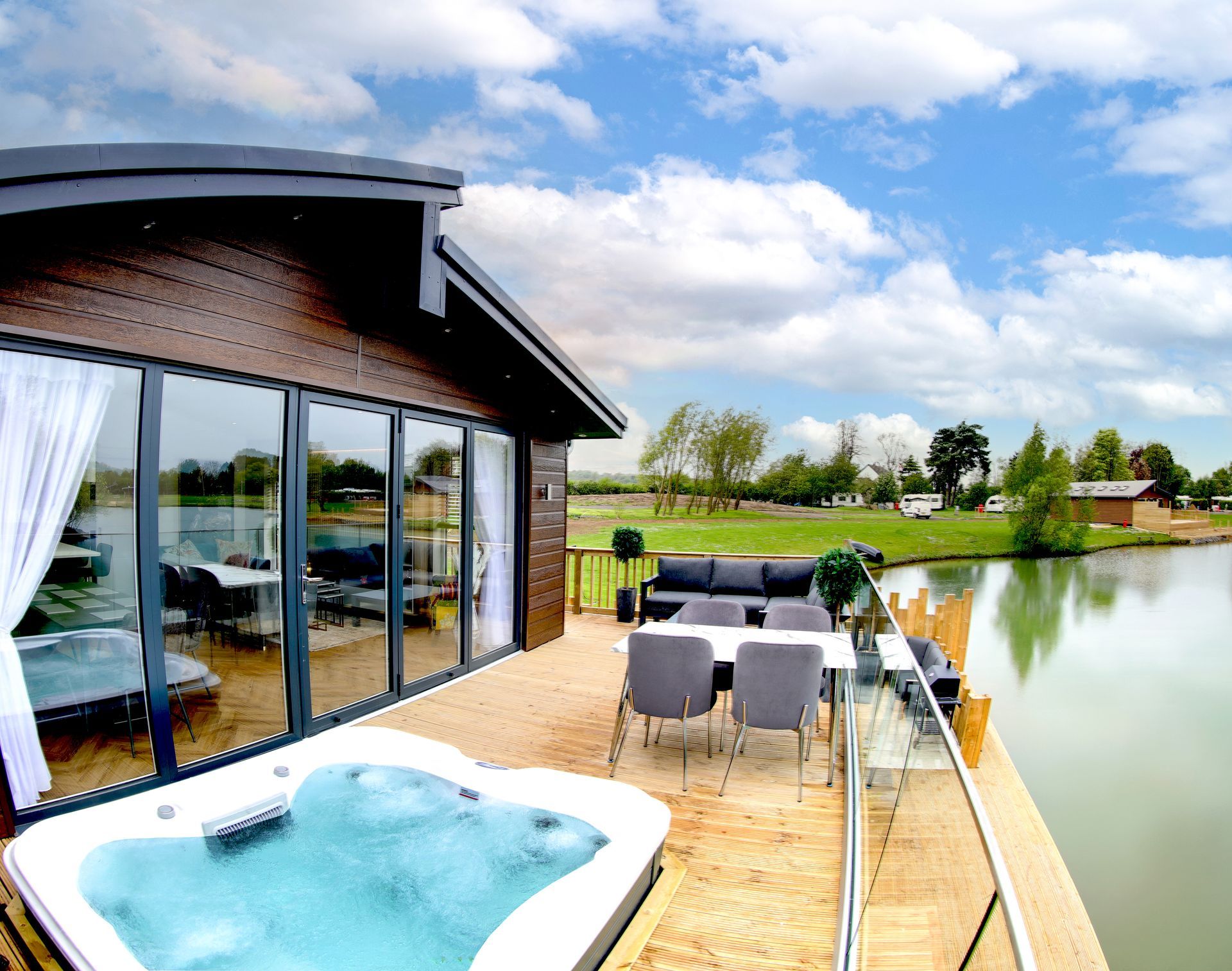 Occupational therapist and wheelchair user reviewing an accessible lodge interior