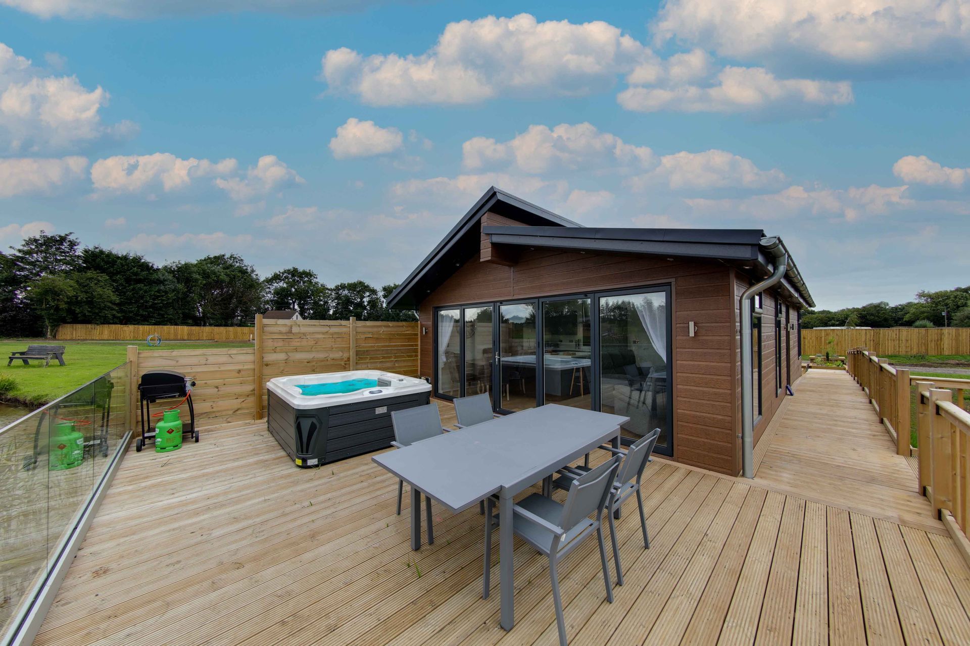 4 bedroom lodge exterior at golden hour with lake view