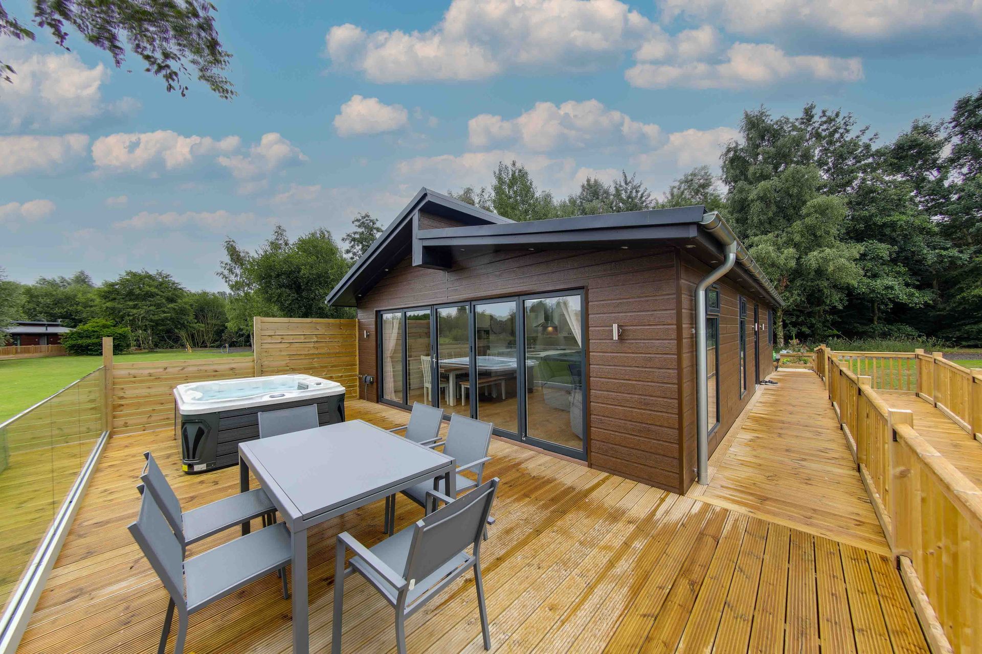 2 bedroom lodge interior with open-plan living and decking