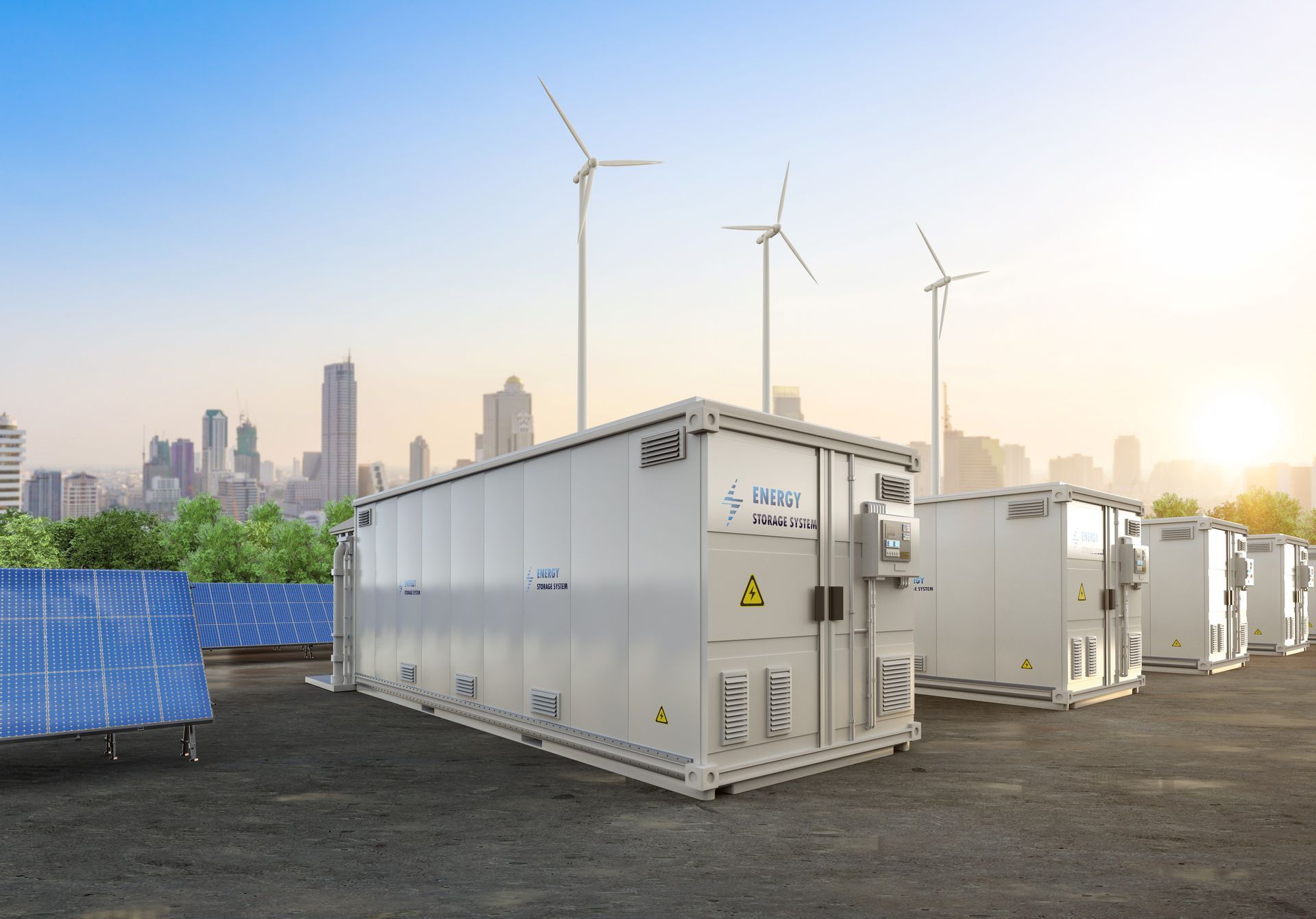 Solar panels and wind turbines power energy storage containers in front of a city skyline.
