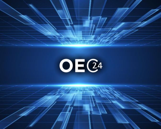 OE24 logo on a blue, futuristic background with glowing lines.