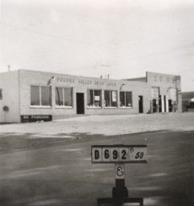 A black and white photo of a building with a sign that says d692 50