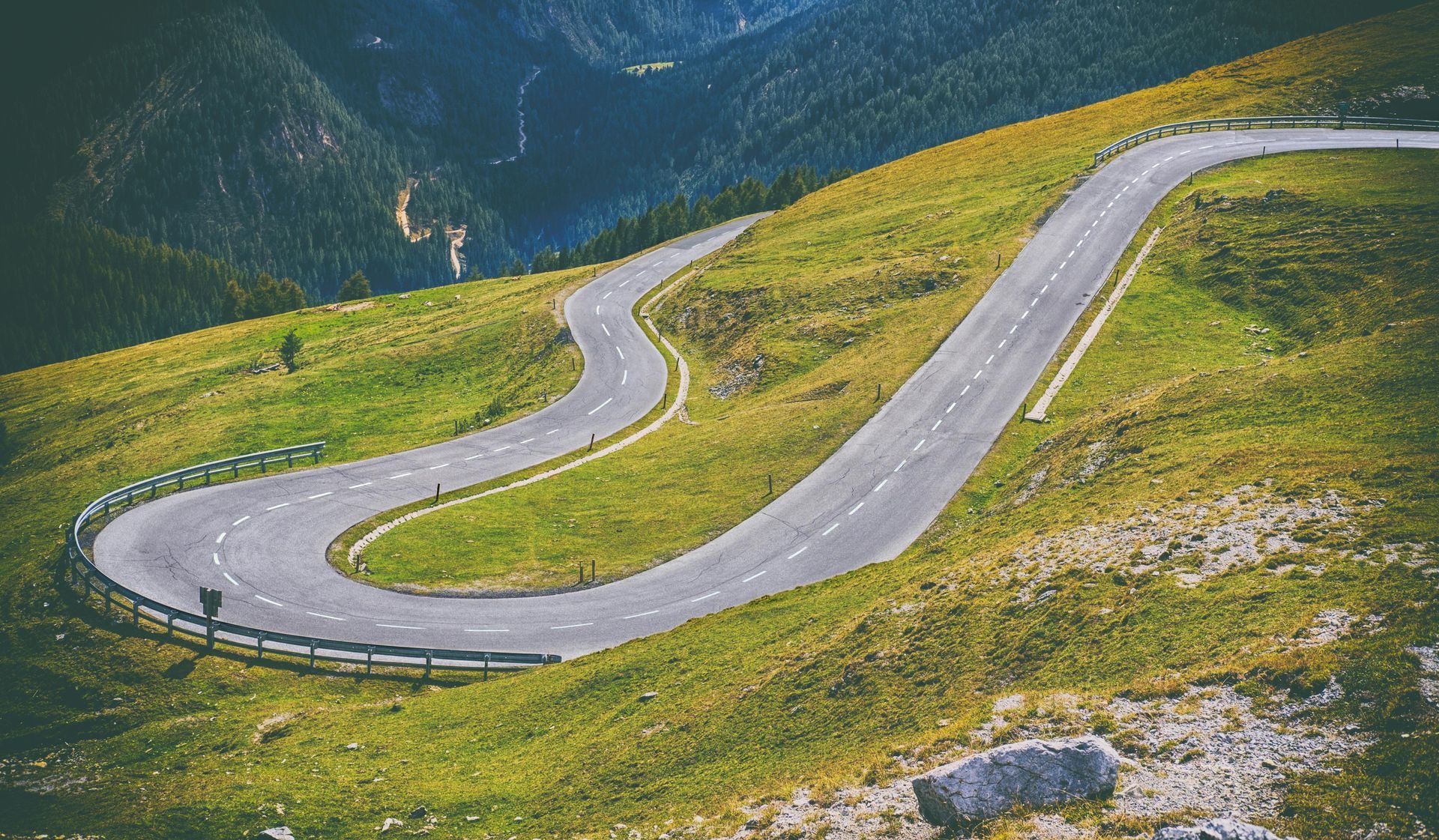 a winding road going up a mountain