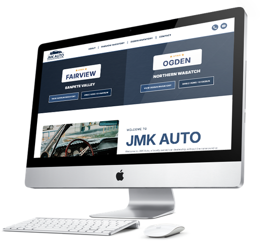 Apple iMac displaying an auto dealership website with JMK Auto and location tiles, on a white desk