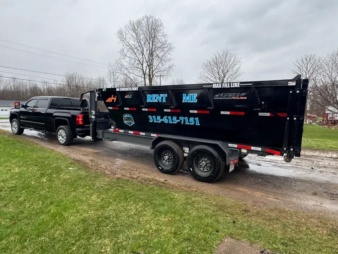 RentAll dumpster delivered to a residential driveway