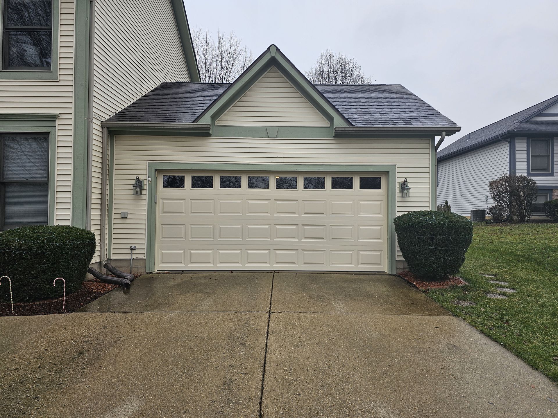 New white garage door after replacement
