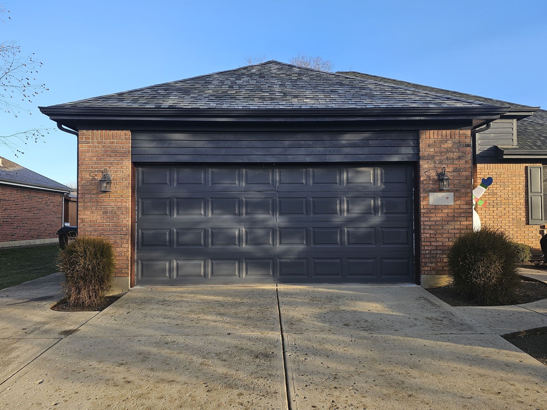 Gray garage door before replacement

