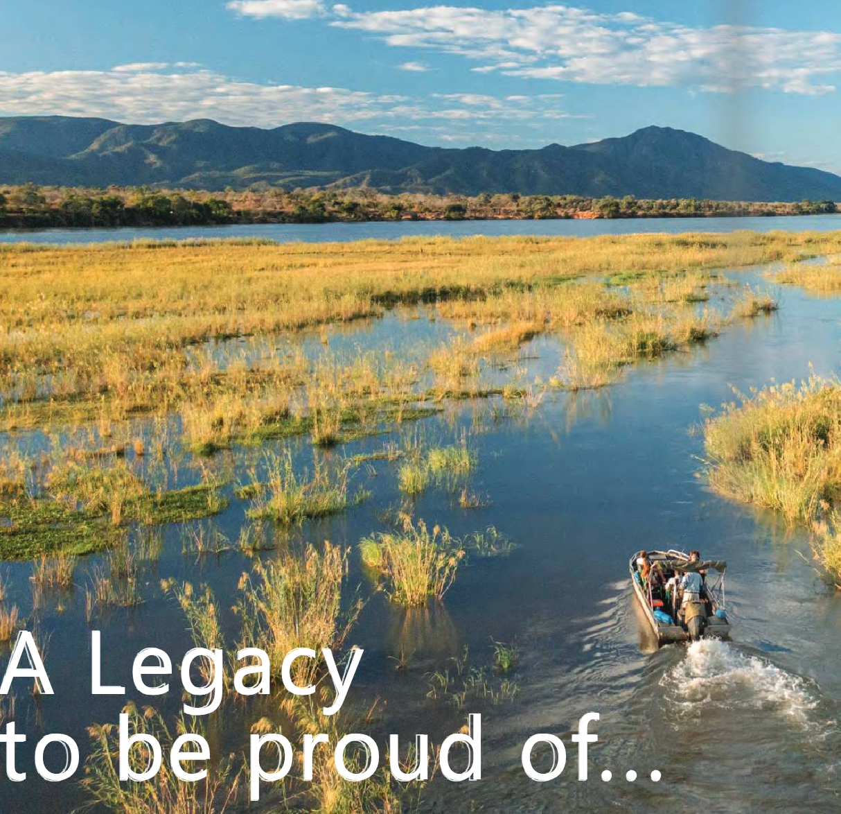 Airboat speeding through a marsh at sunset with mountains in the background and the text “A Legacy to be proud of...”