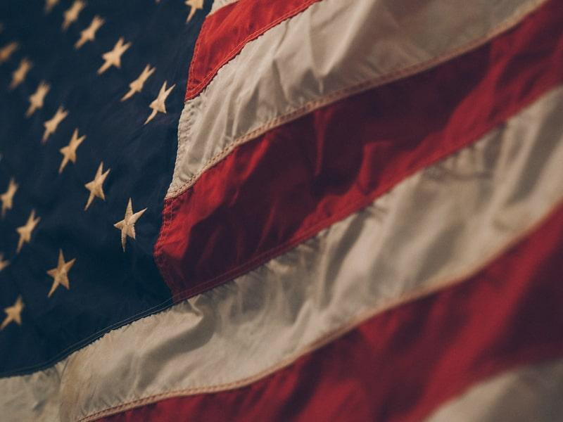 Close-up of a waving American flag with stars and red-and-white stripes