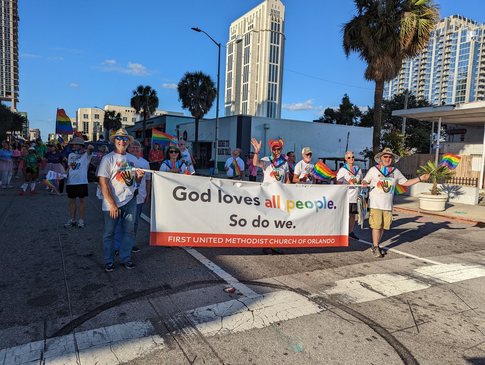 Group holds banner at Pride parade: