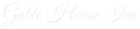 Faint white cursive “Gable House Inn” logo on a light background
