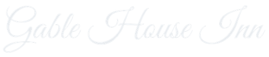 Faint white cursive “Gable House Inn” logo on a light background