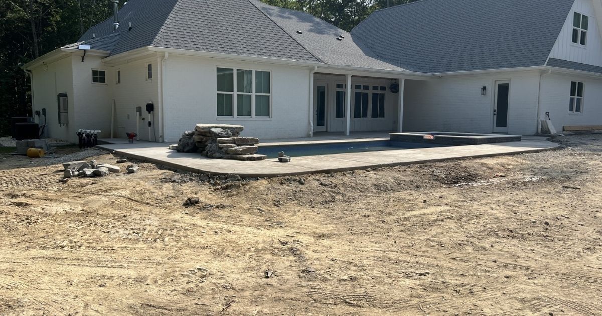 Before photo of Clover SC backyard and pool area before landscaping, grading and sod installation
