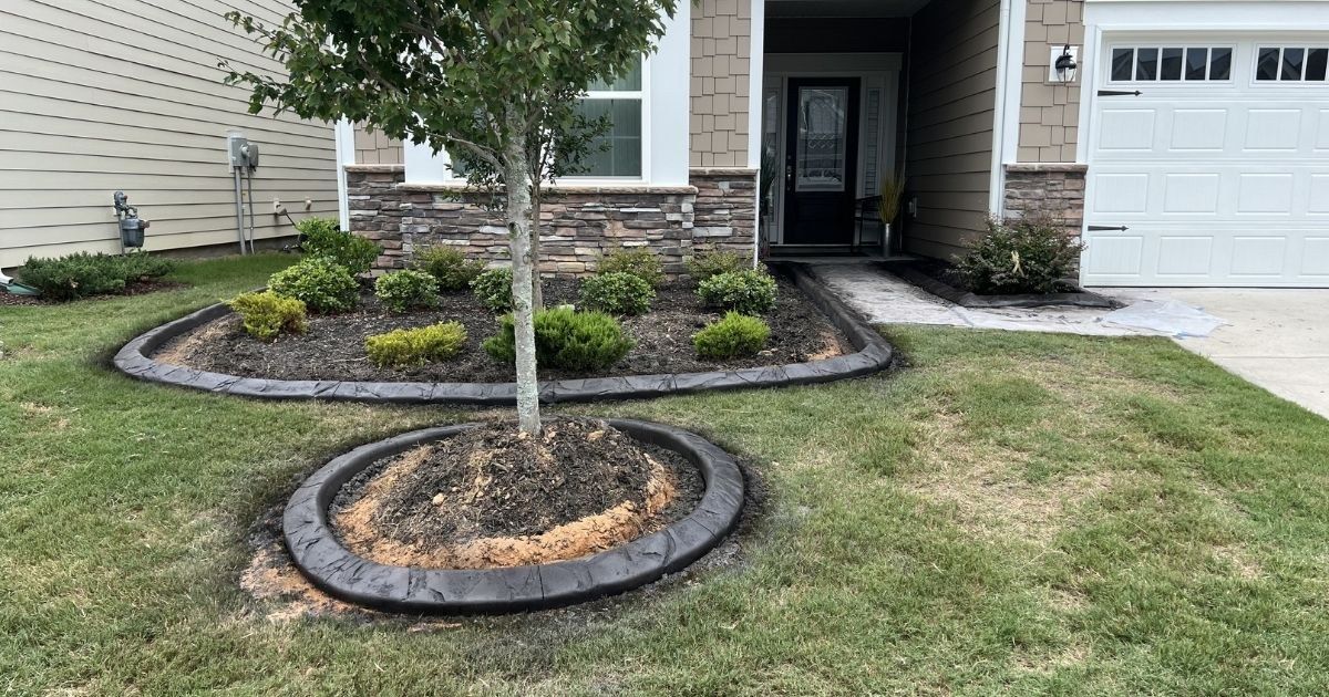 Before photo of well house area before curbing rock and plant installation in Clover SC