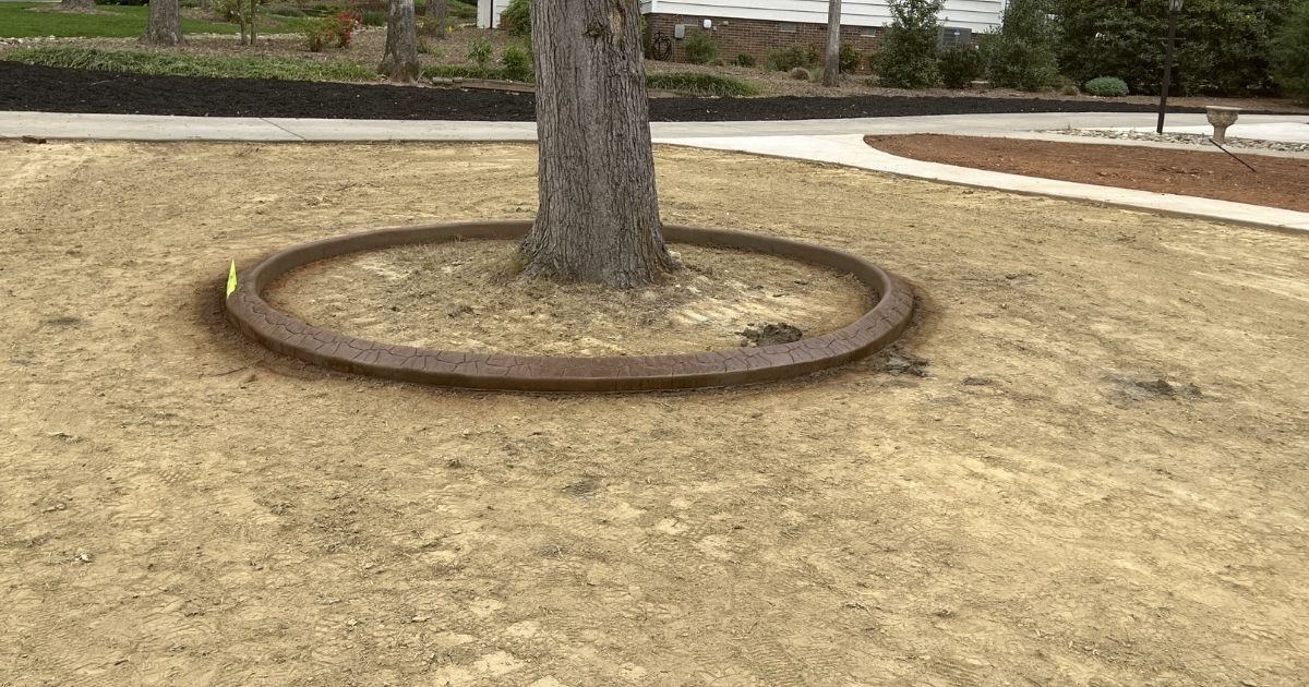Before photo of well house area before curbing rock and plant installation in Clover SC