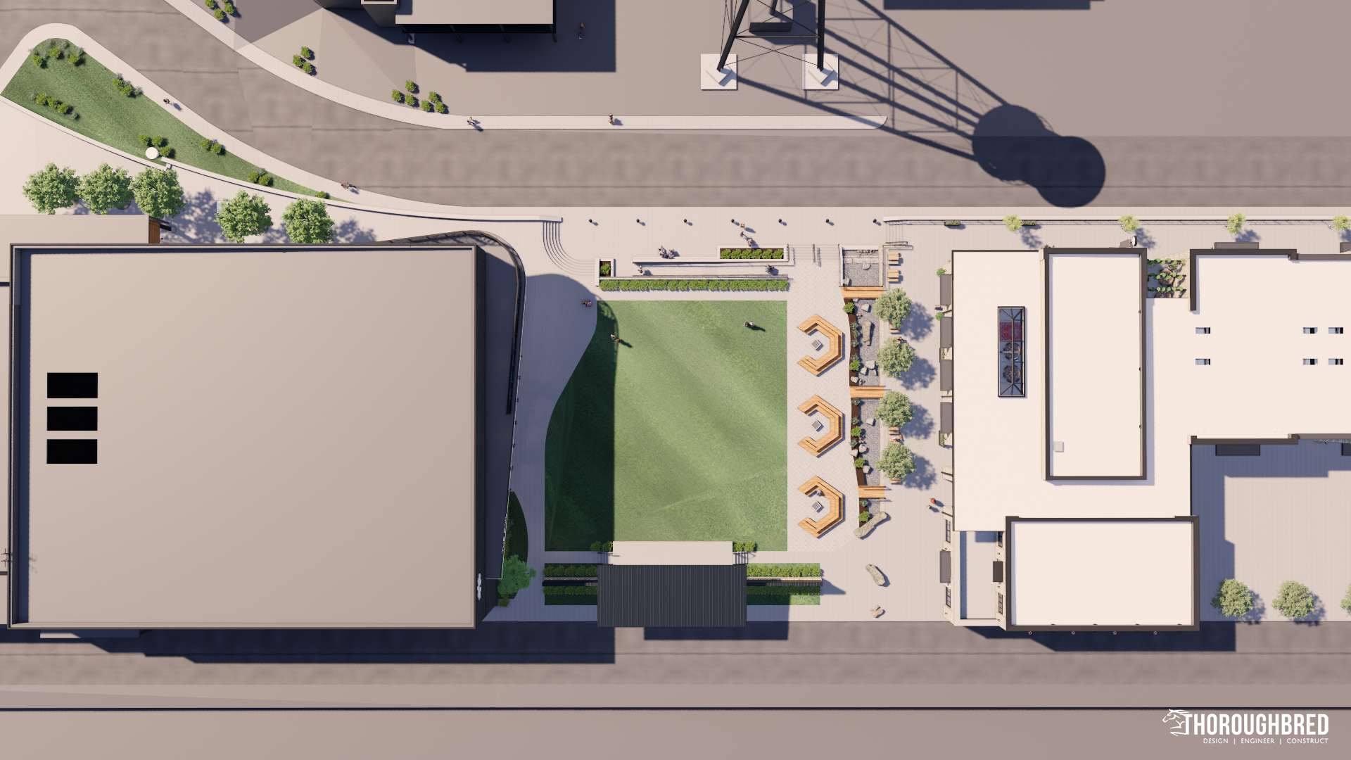 Overhead view of a public square with buildings, a green field, seating areas, trees, and sidewalks.