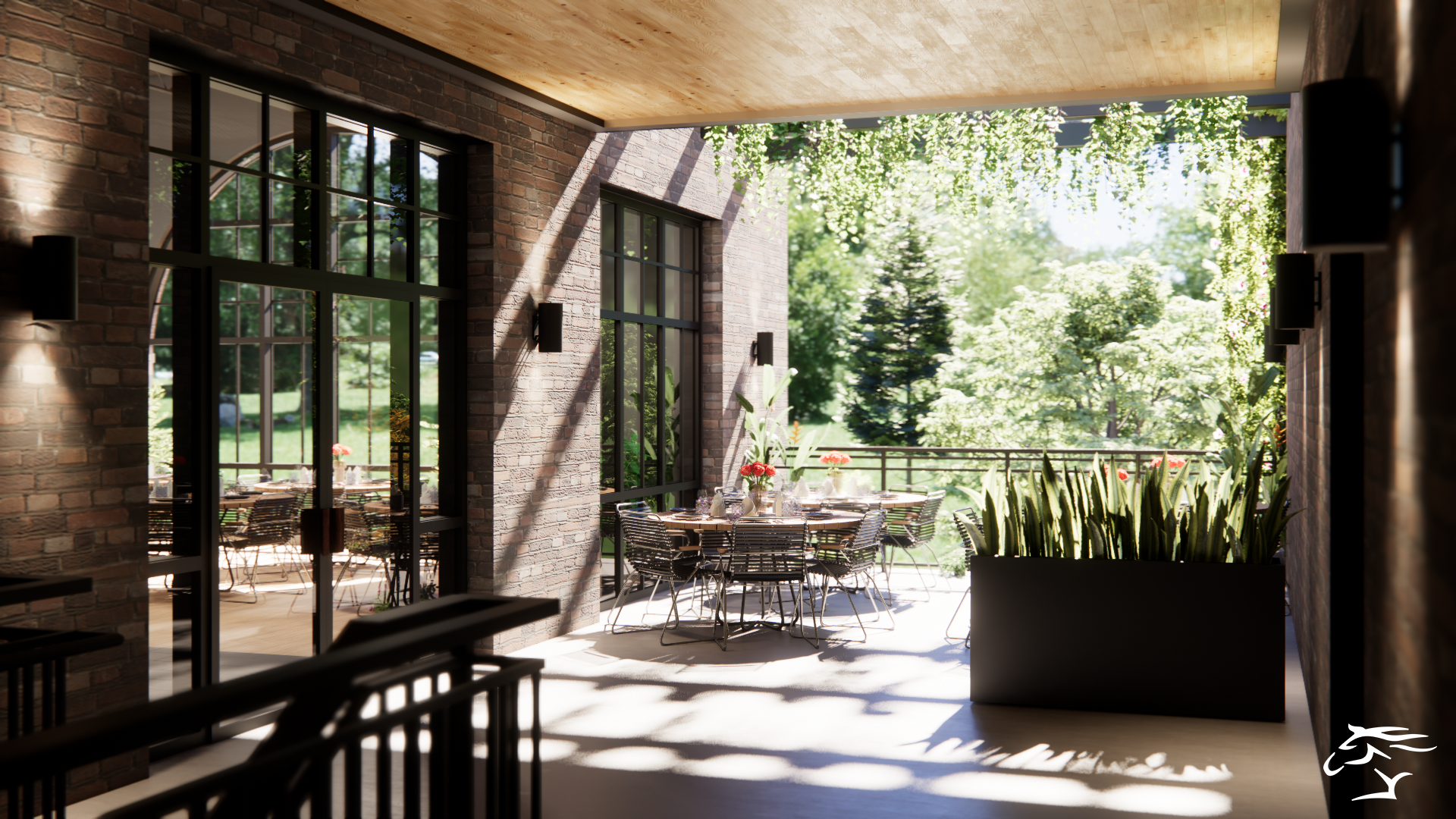Brick-walled patio with tables, chairs, and large windows overlooking a lush green landscape.