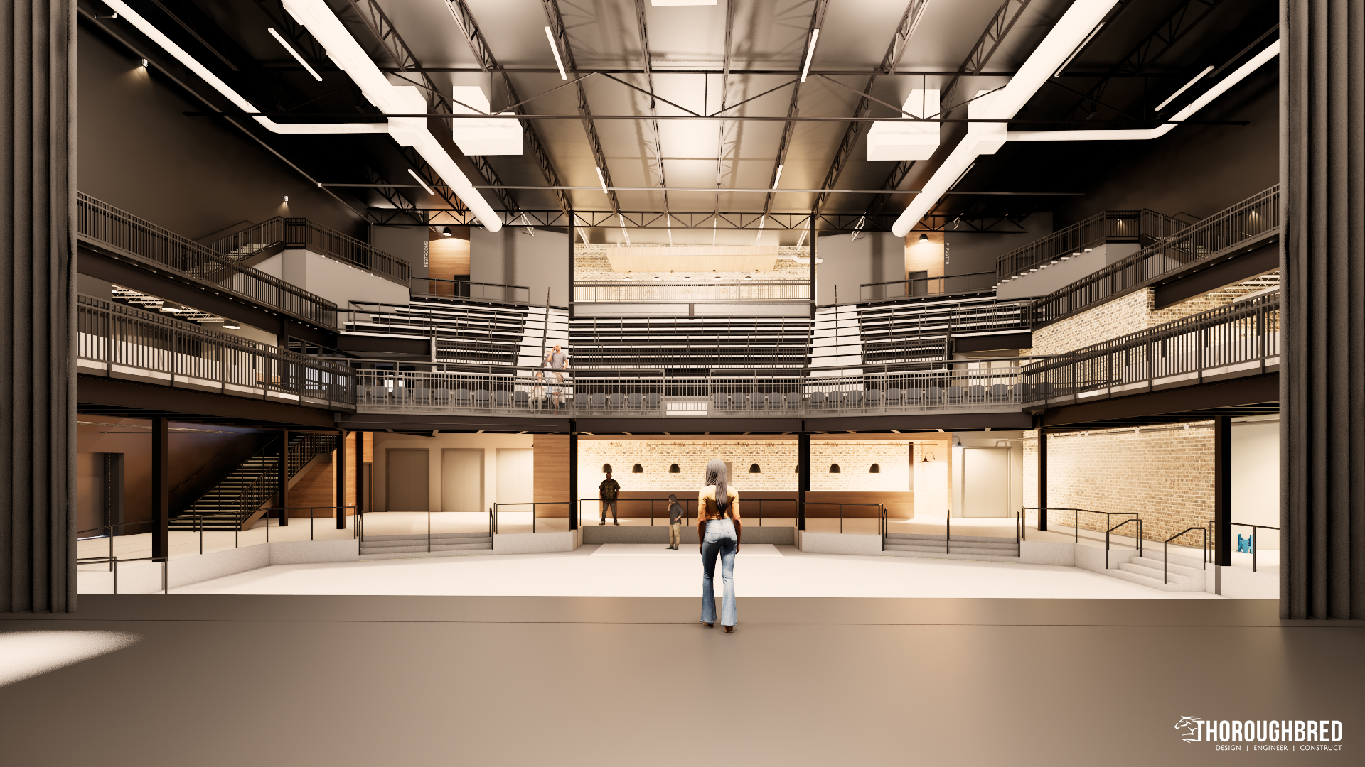 Interior view of a multi-level building. A person stands in the foreground, facing the open space. Steel beams and exposed ceilings.