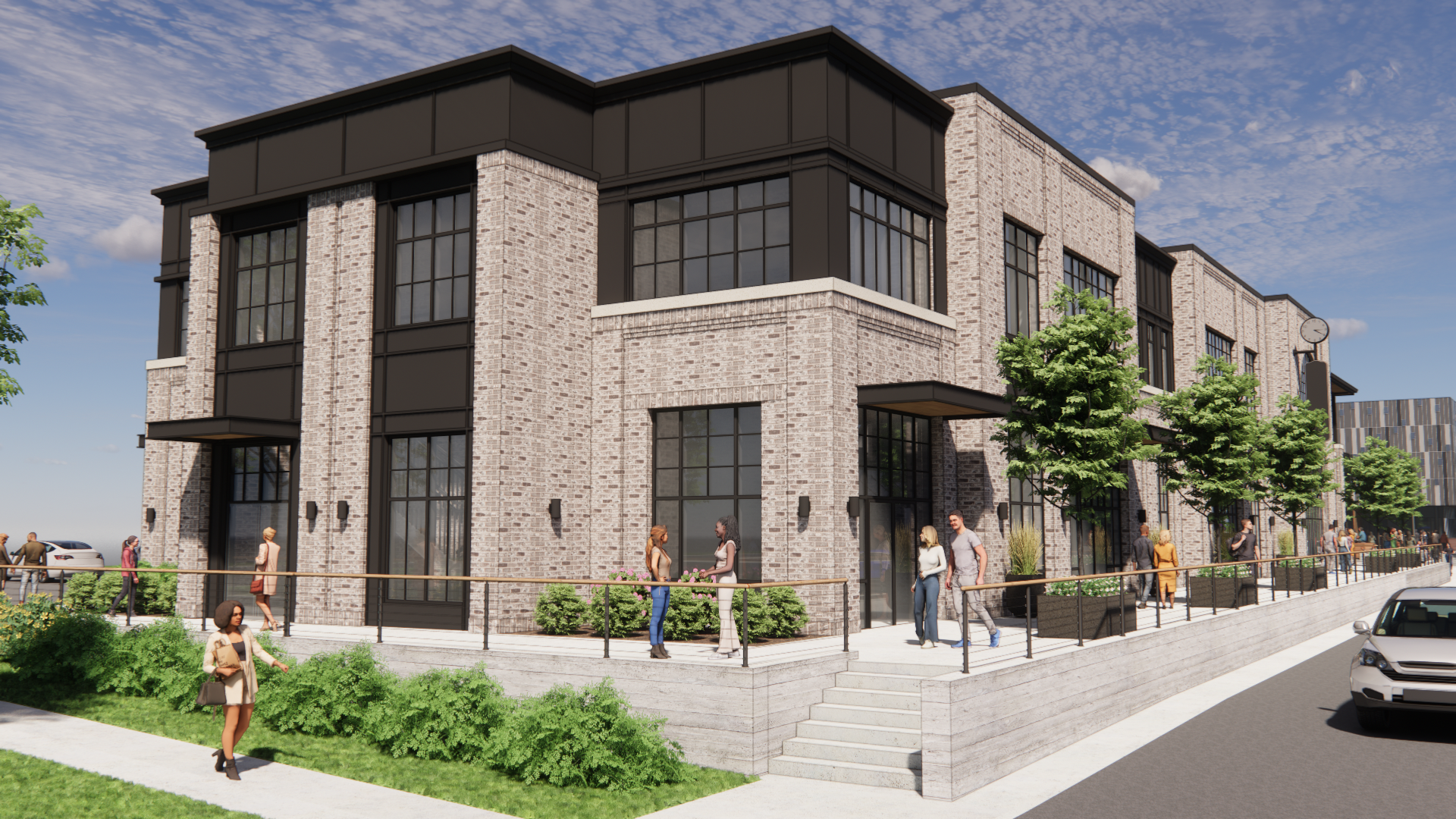 Two-story brick building with black accents and large windows. People stand outside.