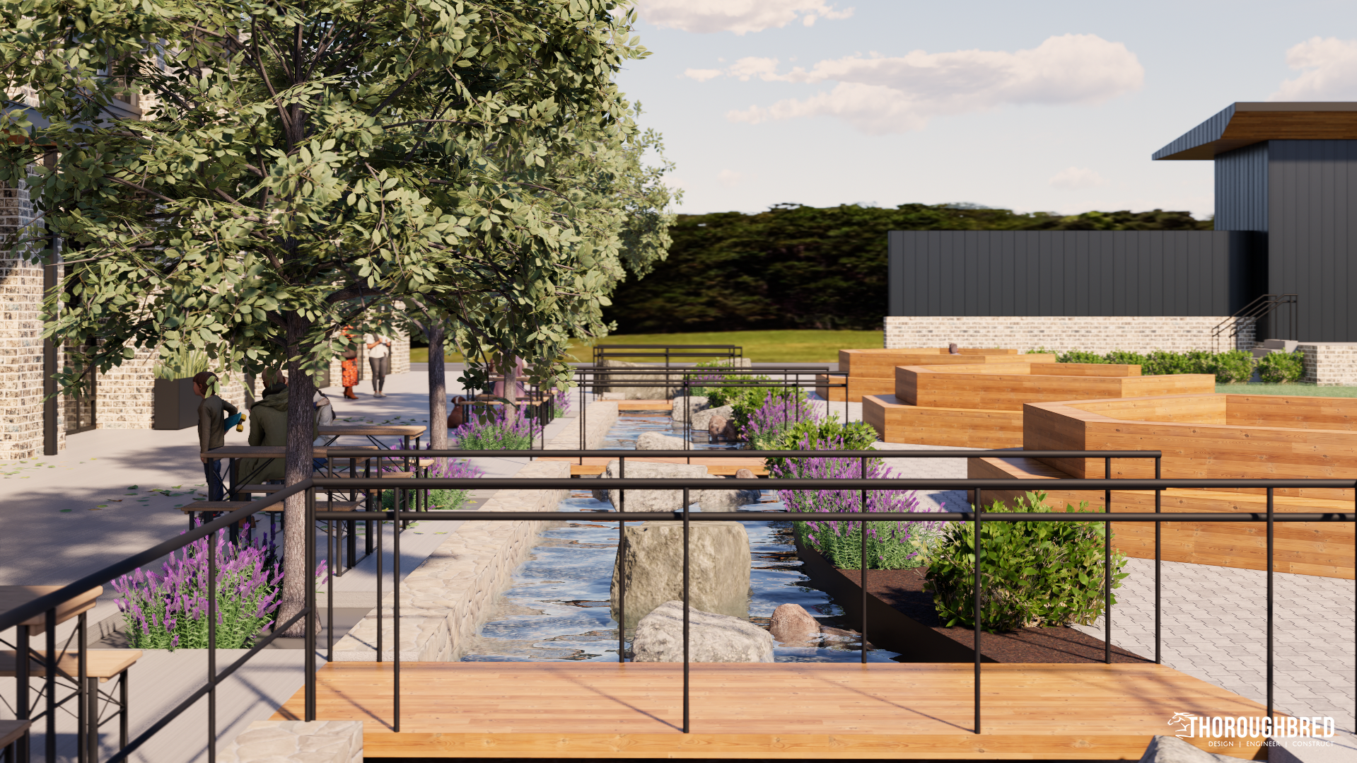 Outdoor dining area with water feature and wooden walkways. Trees and shrubbery, modern building in background.