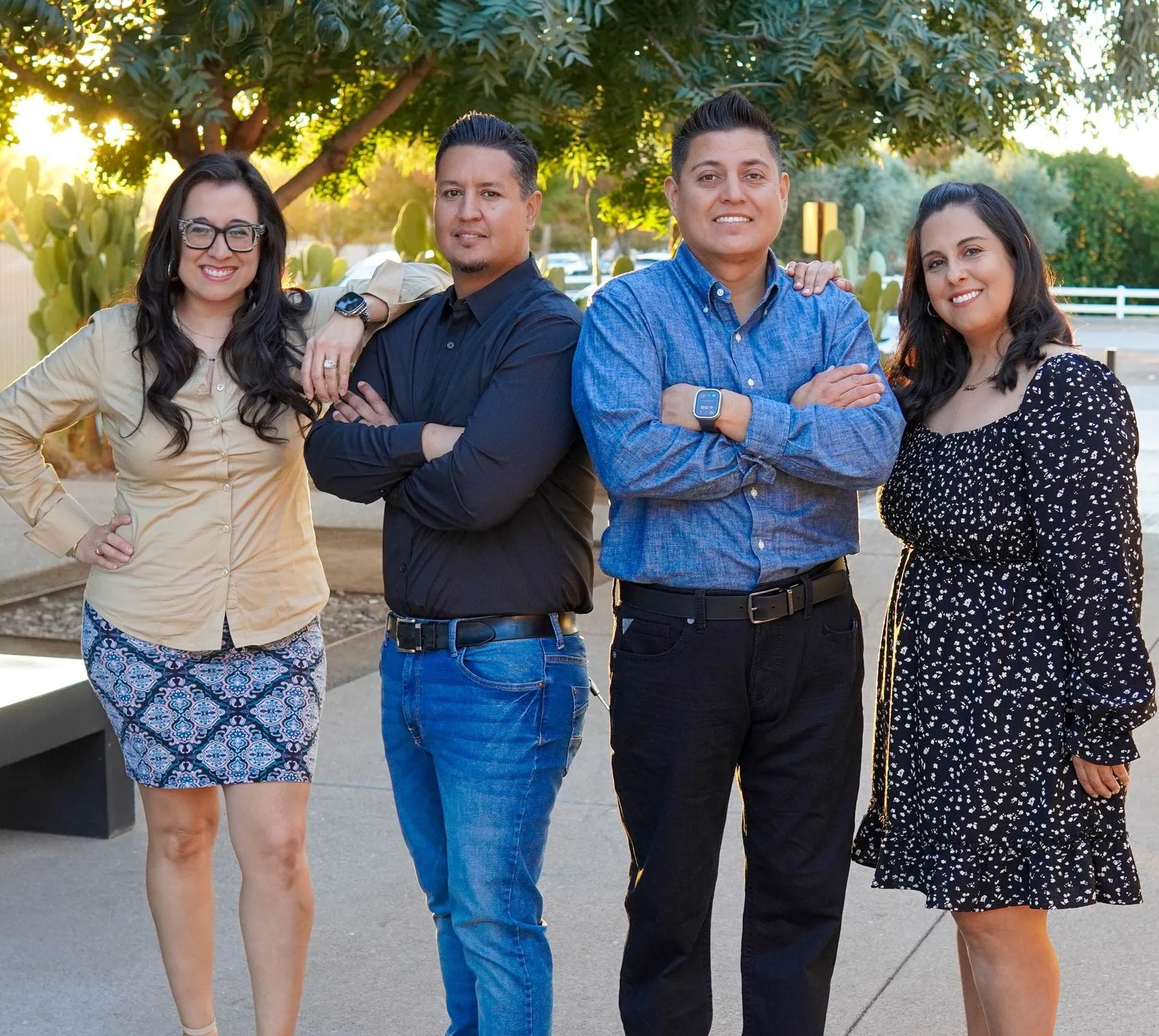A group of people posing for a picture with their arms crossed