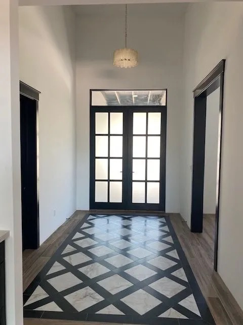 A hallway with a black and white checkered floor
