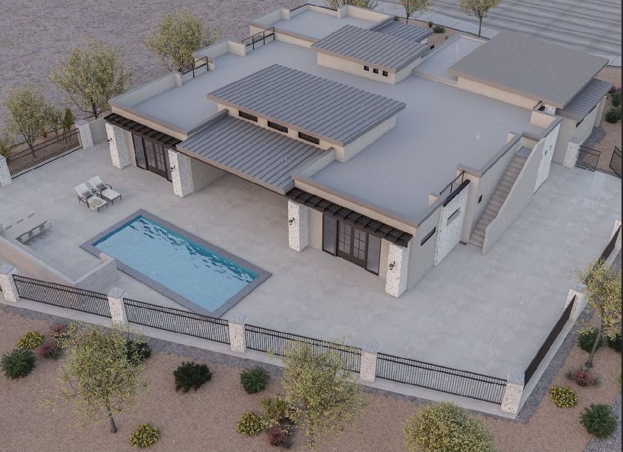 An aerial view of a house with a swimming pool