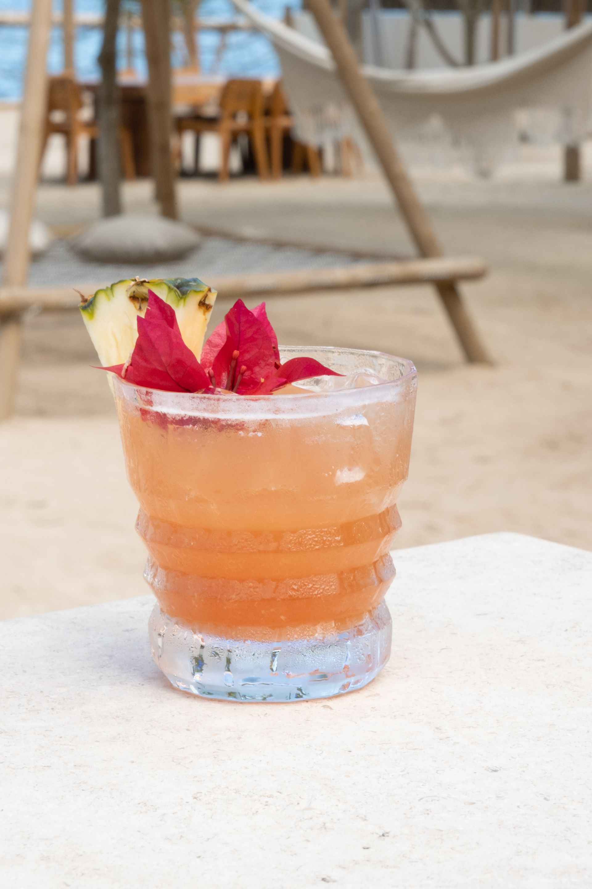 Artisanal cocktail prepared at Ara Macao Bar in a beachfront hotel in San Antero, with natural ingredients.