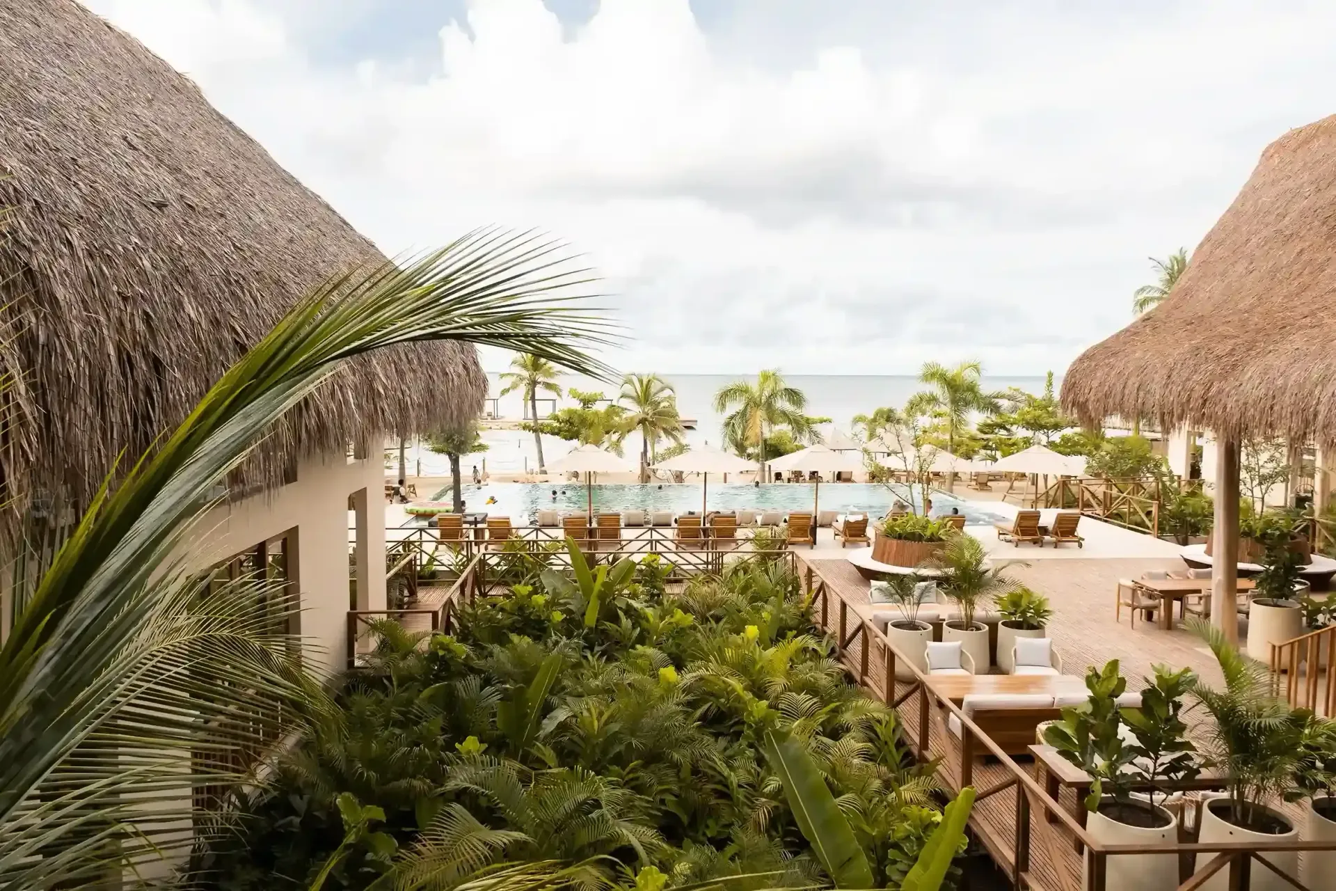 Social areas and terraces at a hotel in Punta Bolívar, San Antero, surrounded by greenery and sea views.