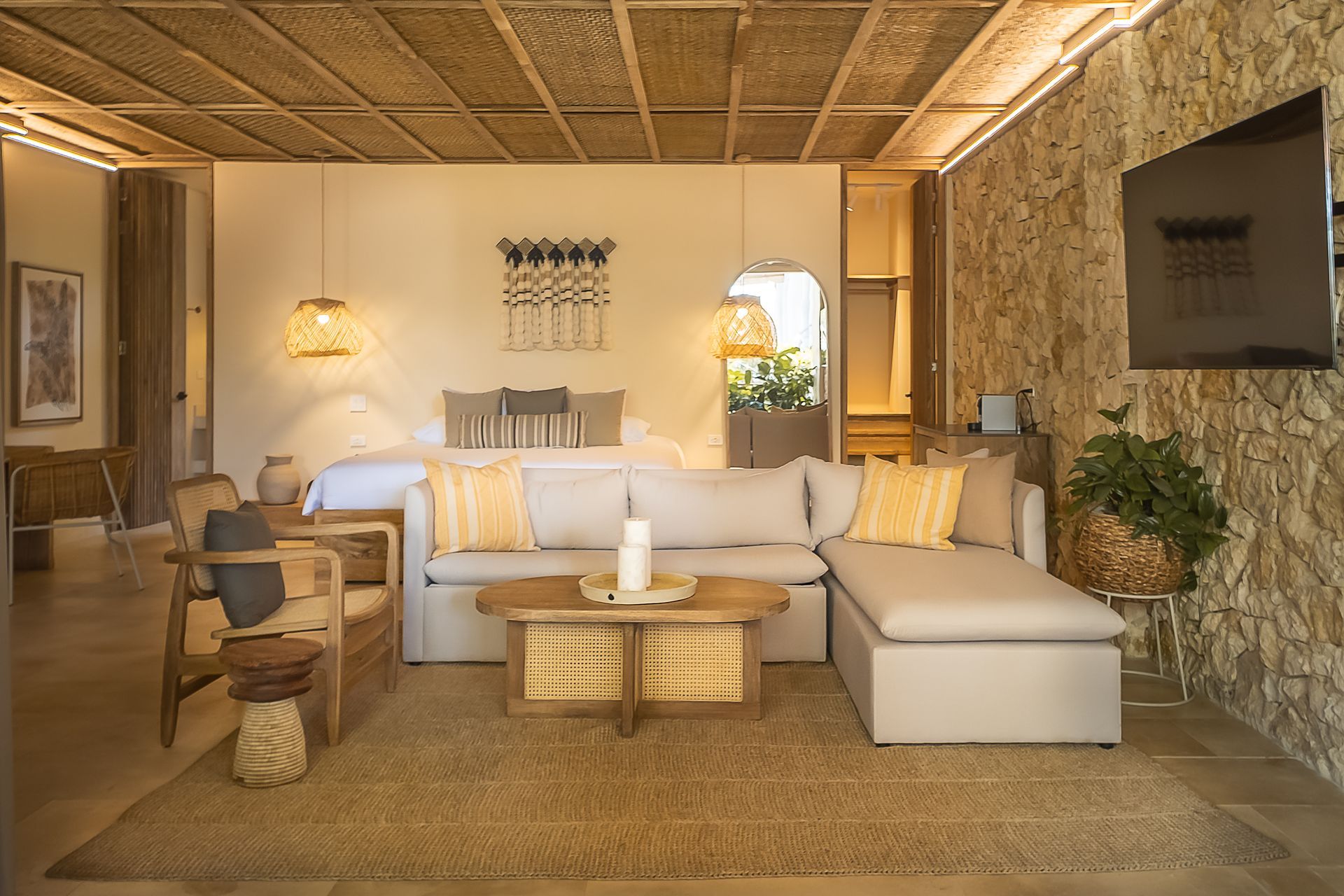 Suite at Aimarawa, one of the hotels in San Antero, with integrated living area and wooden furnishings.